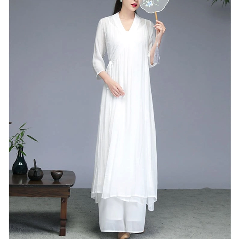 White Zen meditation outfit layered design with V-neck, 3/4 sleeves and side tie in traditional tea room studio setting