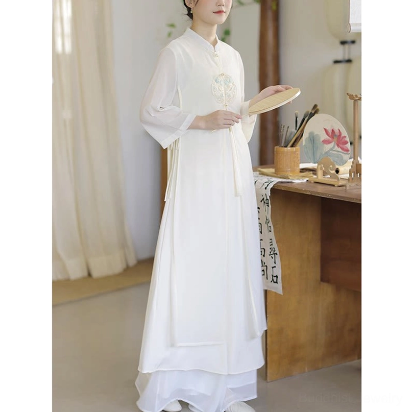 Zen meditation practice dress showing overall silhouette with embroidered motif and breathable chiffon construction