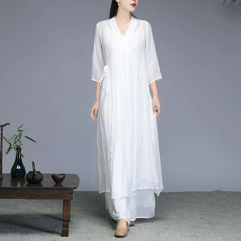Zen meditation chiffon set oblique front view featuring V-neck, 3/4 sleeves, side tie and flowing wide-leg pants for yoga practice