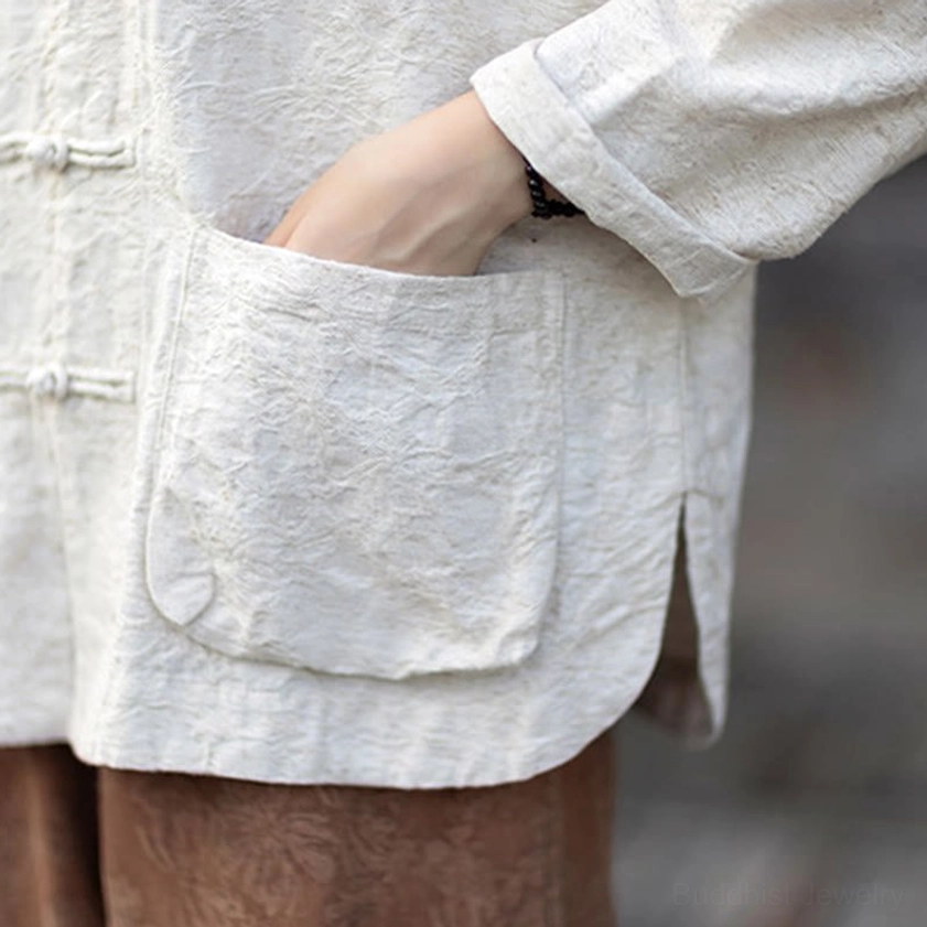 Lifestyle shot of zen meditation shirt and pants set worn with mindful accessories