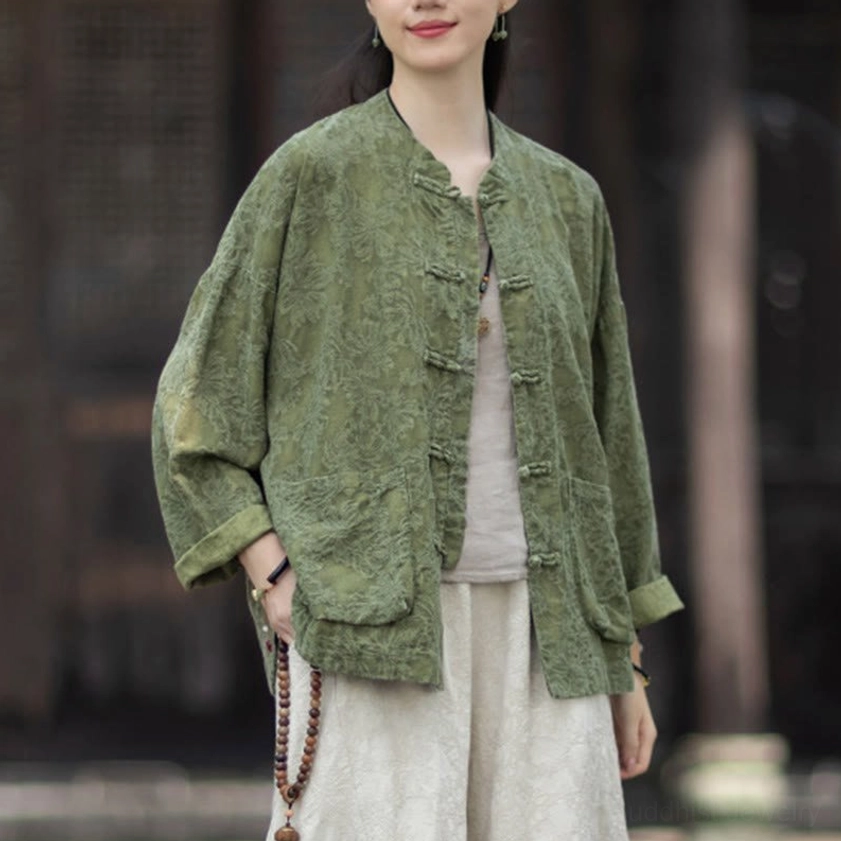 Three-quarter view of zen meditation shirt with rolled cuffs, frog button closures, and stand collar