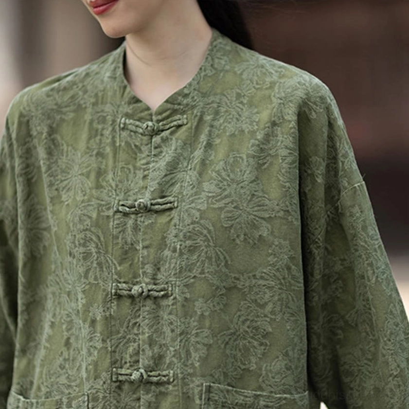 Side profile of zen meditation shirt showing elegant drape, jacquard texture, and stand collar