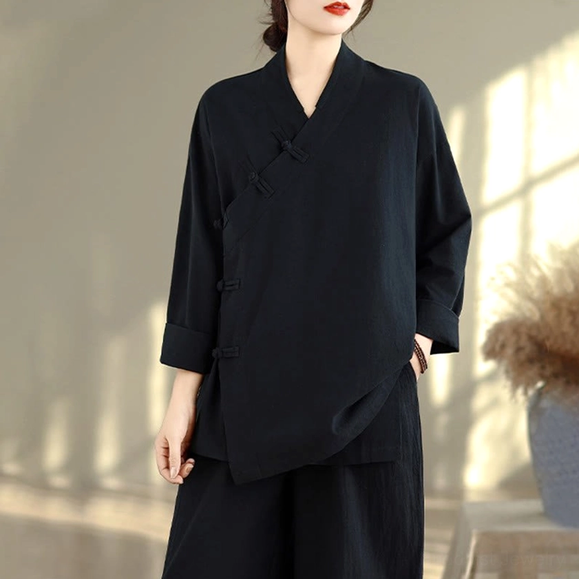 Close-up of beige zen meditation yoga uniform pants showing elastic waistband and wide-leg cut design