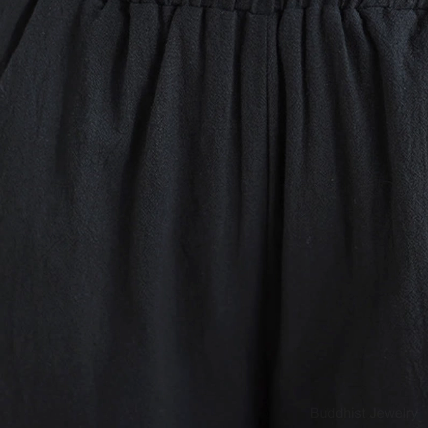 Wide-leg pants detail of zen meditation yoga uniform showing comfortable natural waistline and fabric drape