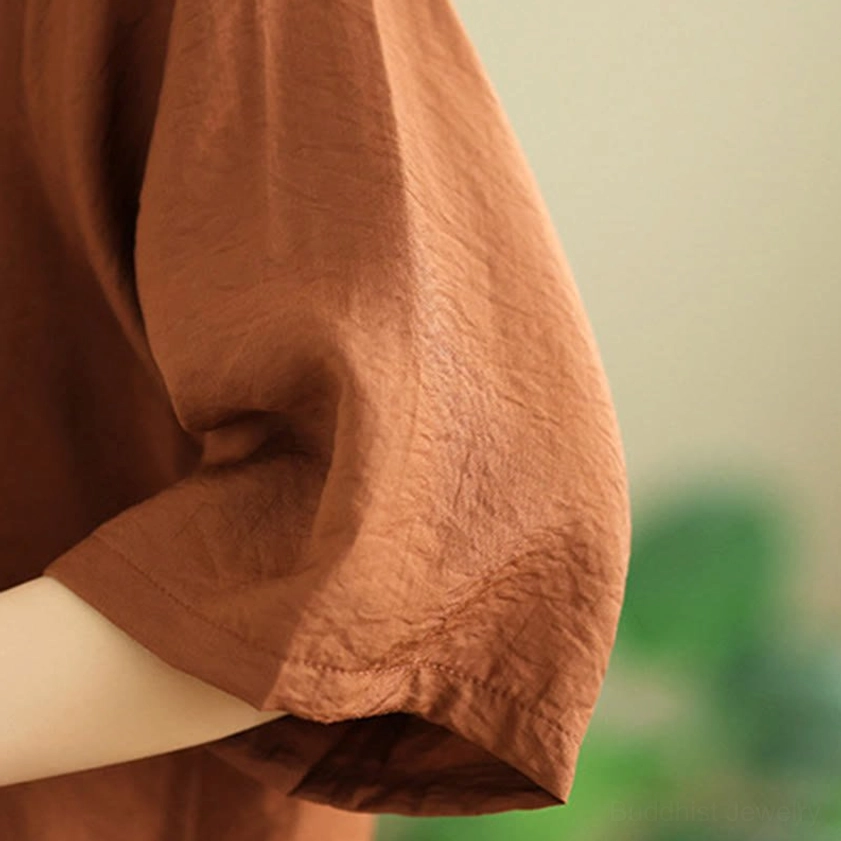 Short-sleeve meditation top fabric - soft wrinkled cotton blend showing half-sleeve design