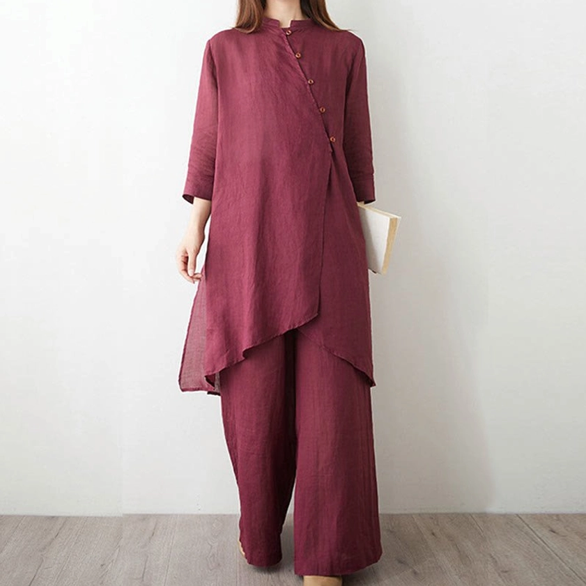 Women's zen tai chi clothing set worn in three-quarter pose with notebook