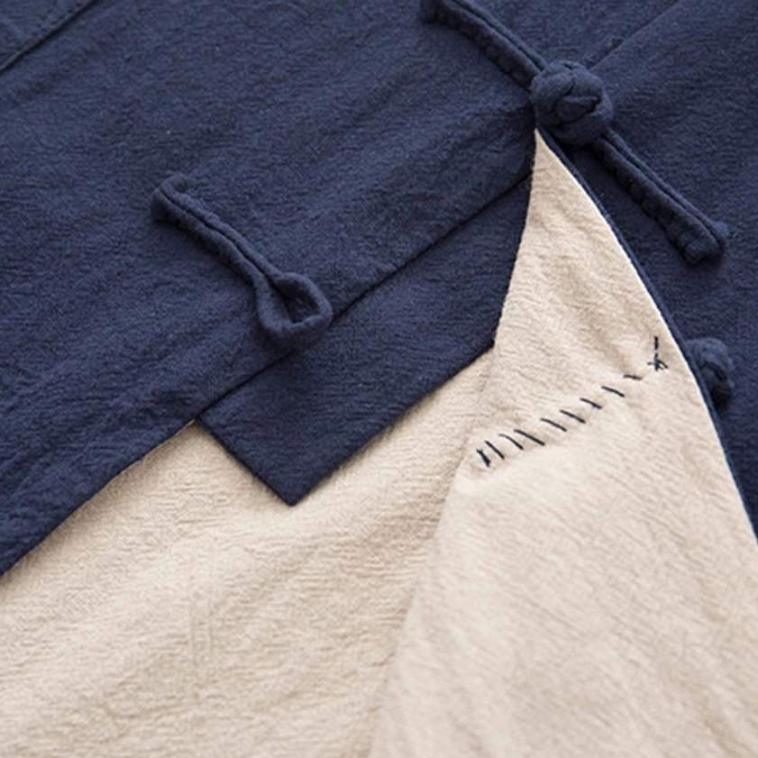 Sustainable natural linen material detail of zen tang suit emphasizing eco-friendly buddhist values