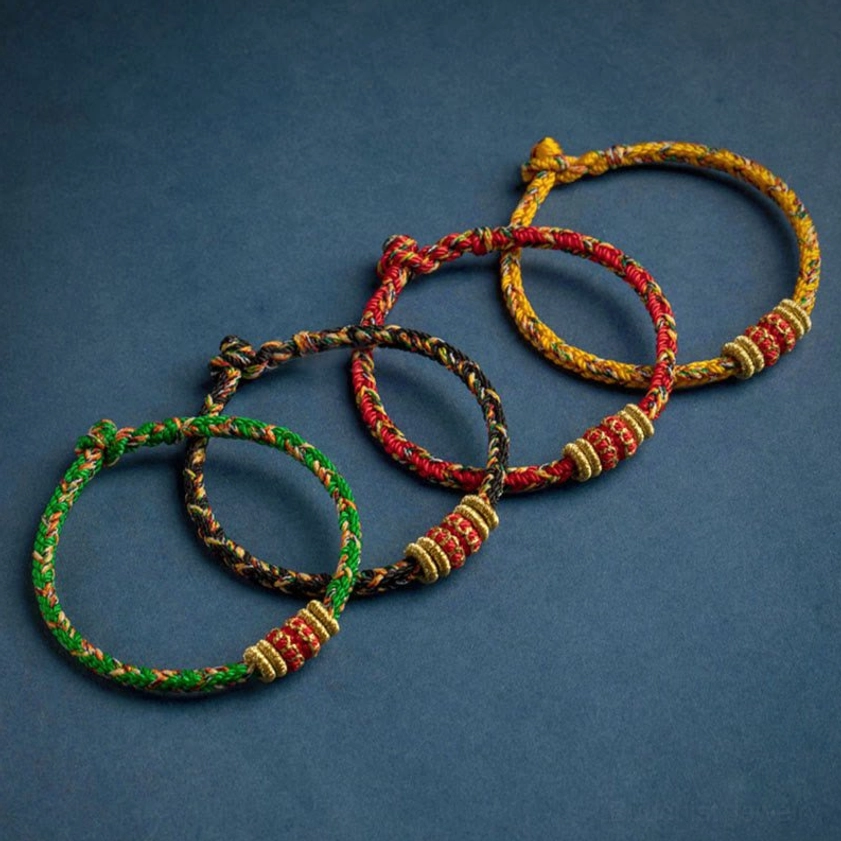 Handcrafted zodiac animal guide bracelet with protective red string and gold charm