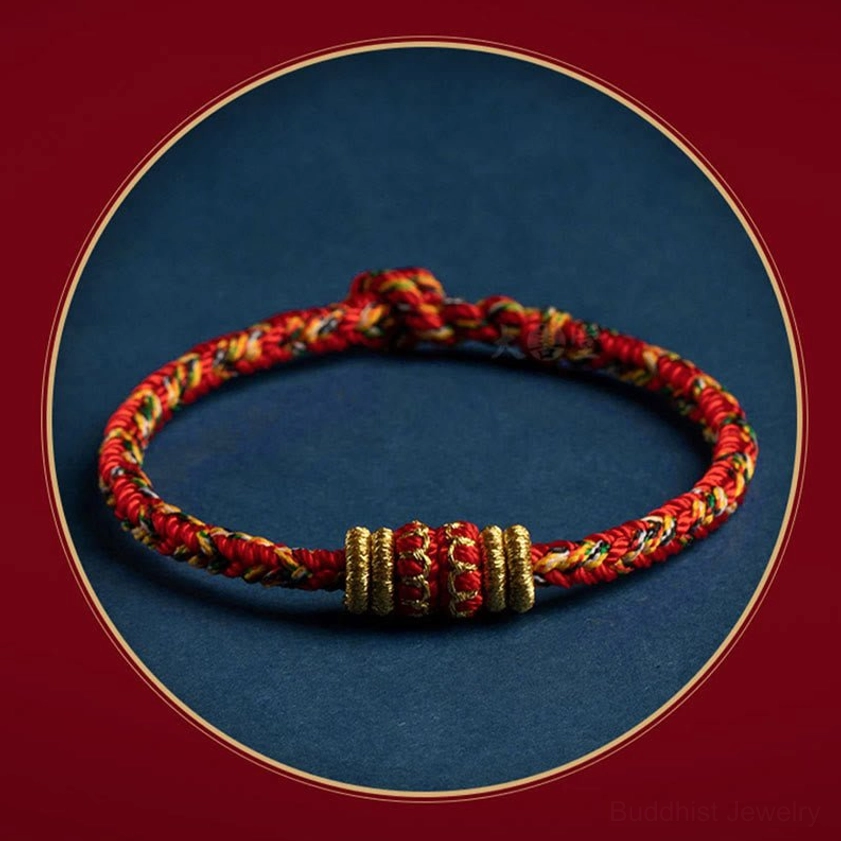 Zodiac natal buddha protection bracelet showing intricate hand-knotted gold decorative accents