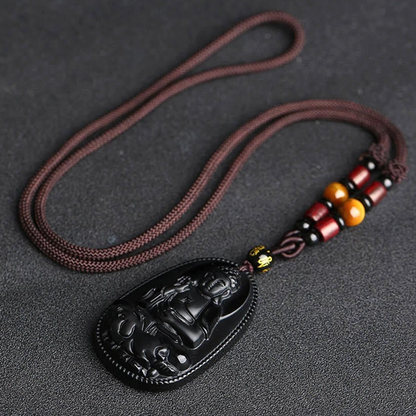 Complete black obsidian zodiac guardian Buddha protection necklace with braided brown cord, beaded clasp and decorative elements