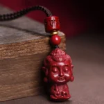 Ox/Tiger Void Bodhisattva cinnabar natal Buddha pendant necklace close-up front view