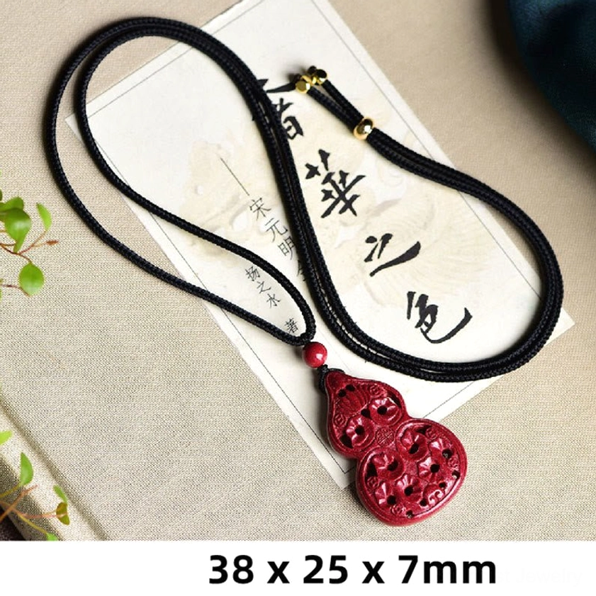 Chinese zodiac animal cinnabar Buddhist pendant necklace cord close-up showing premium black braided string