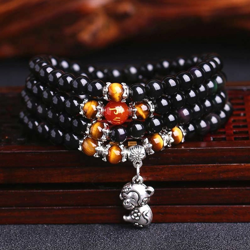 108 bead black obsidian tiger eye zodiac mala bracelet with monkey charm pendant top view