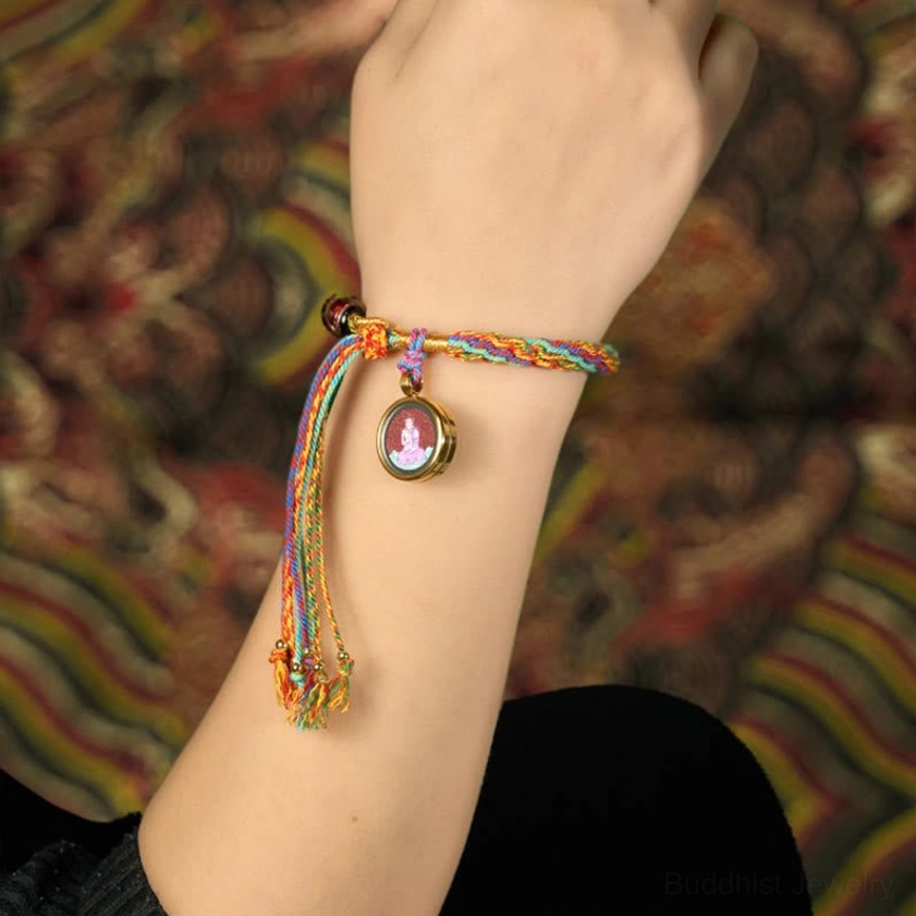 Zodiac natal Buddha bracelet wrist wear demonstration showing proper left-hand placement for receiving spiritual energy and protection