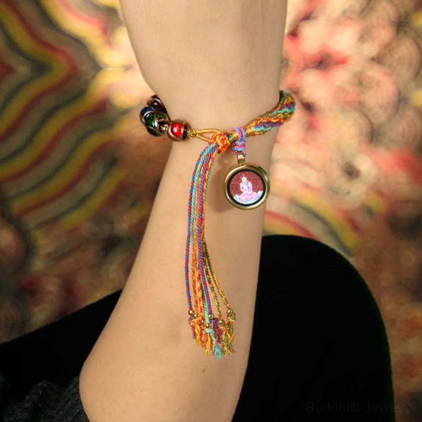 Zodiac natal Buddha braided blessing bracelet lifestyle photo showing natural wear with multicolor silk rope and decorative tassel design