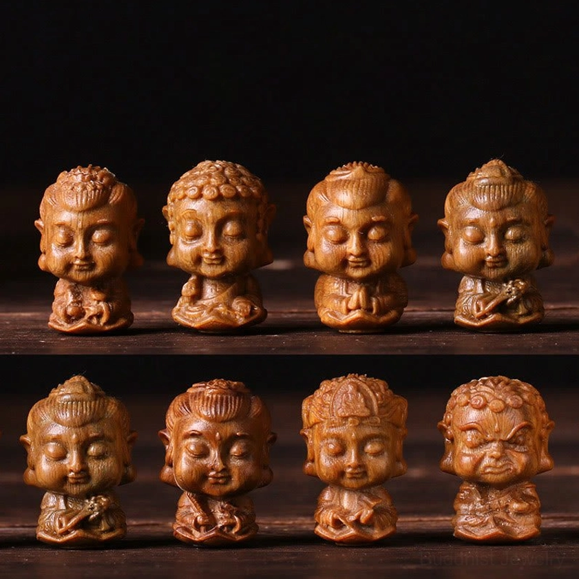Eight zodiac patron Buddha statues arranged in two rows showing Rat Avalokitesvara, Ox/Tiger Void Bodhisattva, Rabbit Manjushri, Dragon/Snake Samantabhadra, Horse Mahasattva, Goat/Monkey Tathagata, Rooster Acalanatha, and Dog/Pig Amitabha complete collection