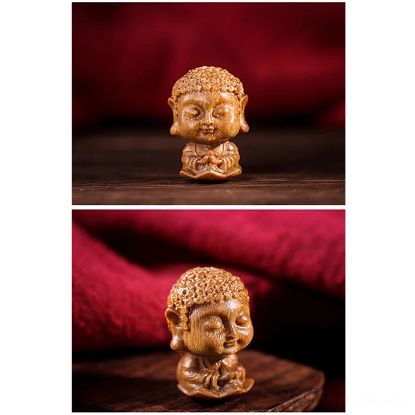 Green sandalwood zodiac natal Buddha carving detail showing lotus engravings symbolizing purity and spiritual enlightenment