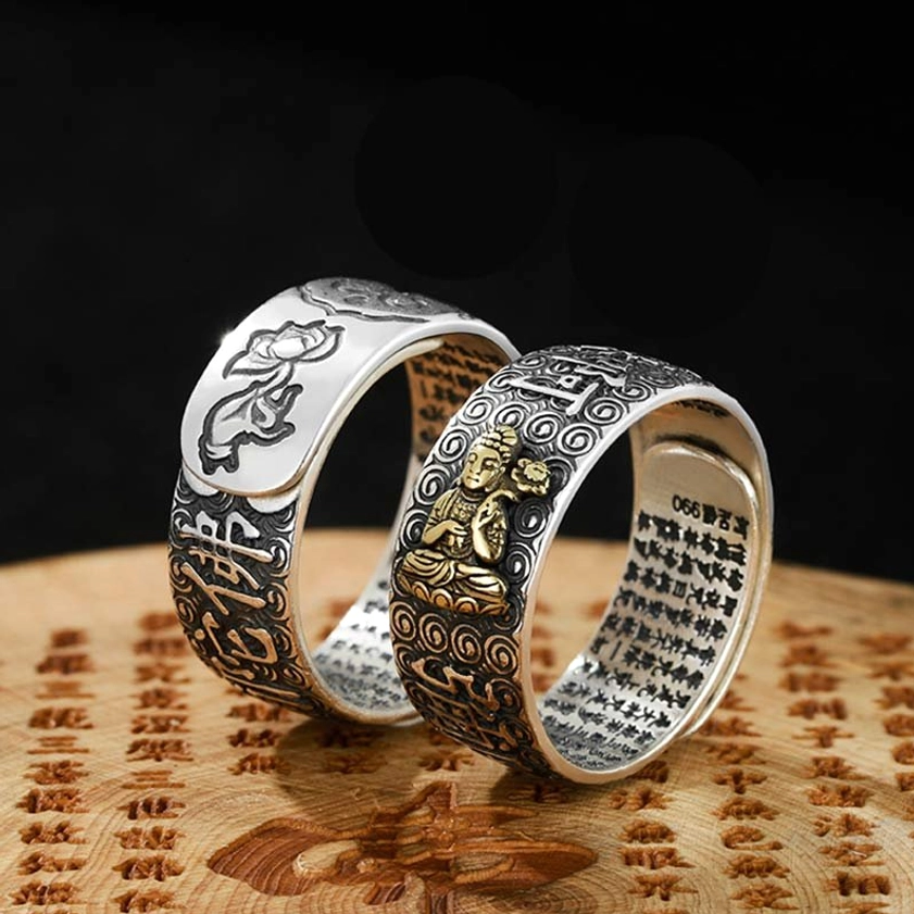 Chinese zodiac natal Buddha adjustable rings on wooden board, showing zodiac animal ornament ring and gold Buddha statue ring with engraved sutras