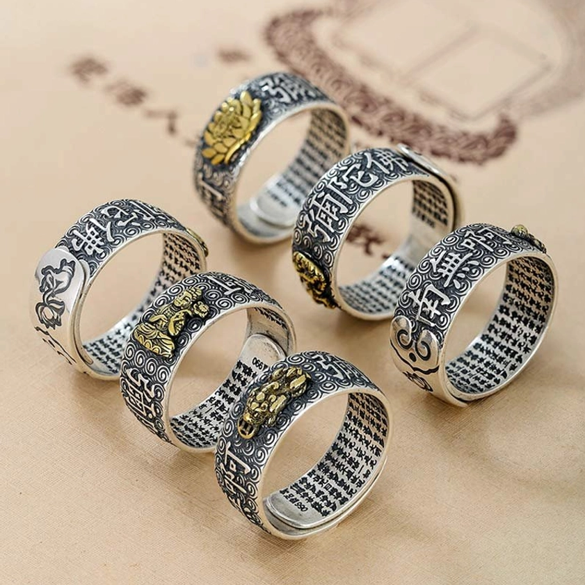 Chinese zodiac natal Buddha rings collection in mixed styles with gold Buddha ornaments, engraved sutras and zodiac patterns, vintage silver tone flat lay display